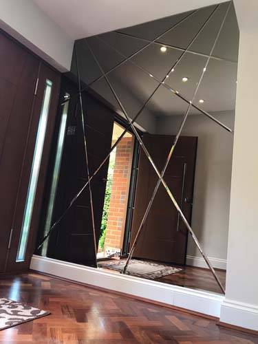 Bronze abstract mirror feature wall